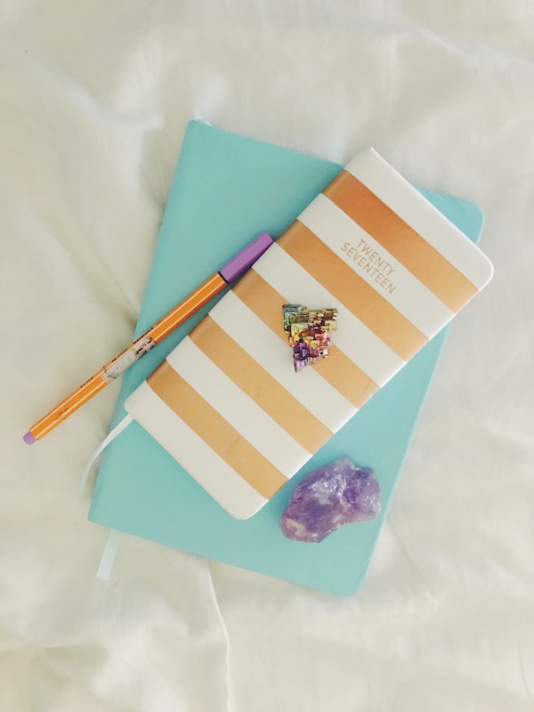 purple and rainbow crystal and diary planner